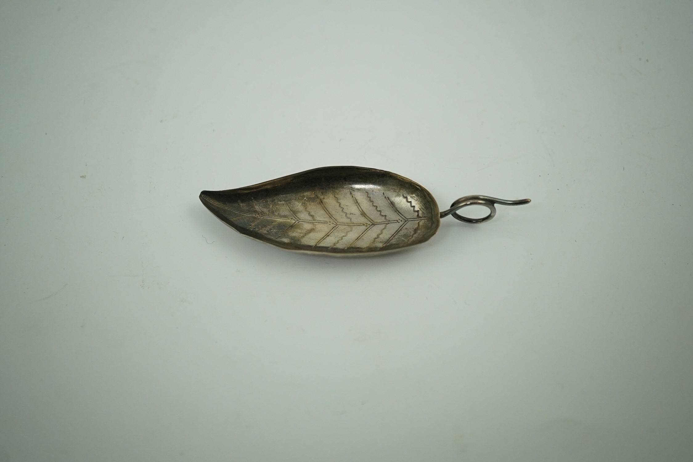 A George IV silver leaf shaped caddy spoon, maker I.T. Birmingham, 1823, 81mm. Condition - fair